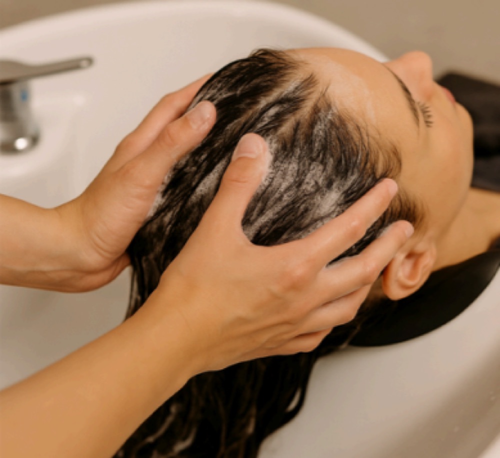 Scalp massage during a head spa ritual